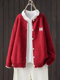 Sundra | Damen Oversized Strickjacke mit H-Logo" can be rewritten as:

"Sundra | Damen Oversized Strickjacke mit H-Emblem